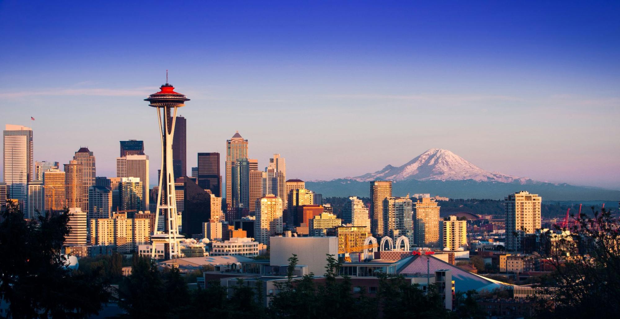 Photograph of Seattle skyline showing Seattle’s Space Needle and in the distance is Mount Rainier (Tahoma)